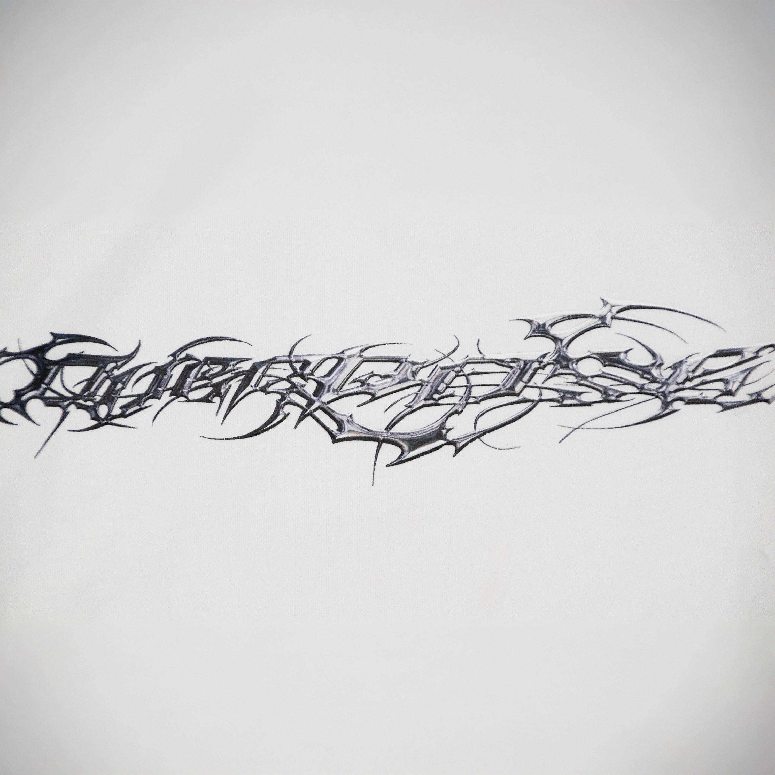 "TRIBAMETAL" LOGO TRNSFRMR L/S - ANGEL